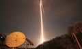 A rocket lights up a dark sky as it lifts off at Cape Canaveral.