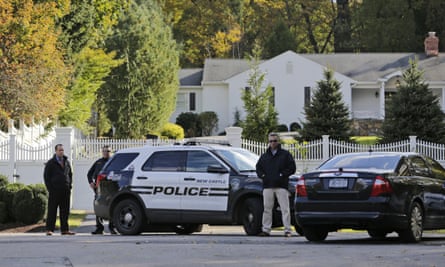 Police officers stand in front of property owned by Hillary and Bill Clinton in Chappaqua, N.Y.