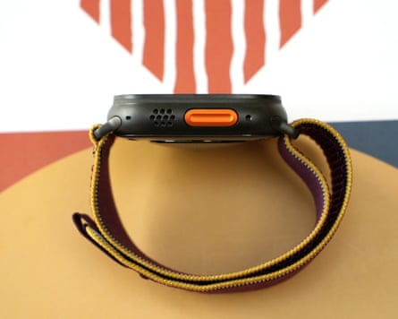 The orange action button in the side of an Apple Watch Ultra 4.