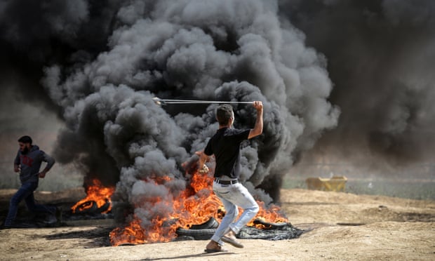 People take part in protests at the Israel-Gaza border