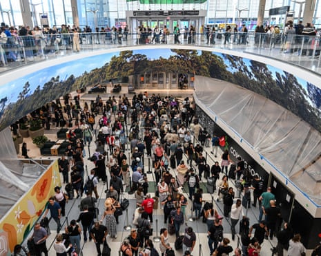Travelers wait in long security lines at George Bush Intercontinental Airport in Houston, Texas on 23 March.
