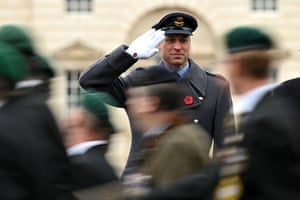 Prince William salutes veterans marching past on Horse Guards Parade in central London on Remembrance Sunday