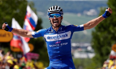 Julian Alaphilippe celebrates after crossing the finish line in Épernay to take the third stage and overall lead.