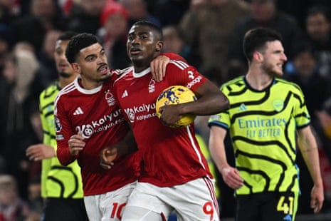 Nottingham Forest's Nigerian striker #09 Taiwo Awoniyi runs back with the ball after scoring late on.