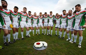 The Keighley players gather round the wreath laid to remember their teammate Danny Jones