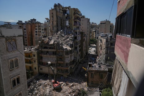 Rubble atop a destroyed high rise building.