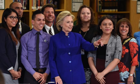 Hillary Clinton, centre, poses with students and faculty after discussing immigration reform at Rancho high school in Las Vegas on Tuesday.