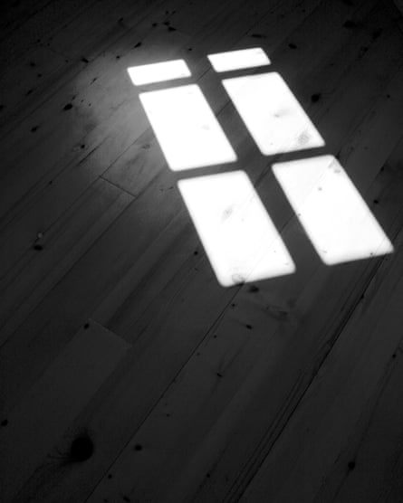 Shadow and light projected on to a flood through a silhouetted window