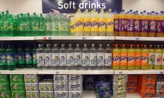 Bottles and can of soft drinks in a supermarket.
