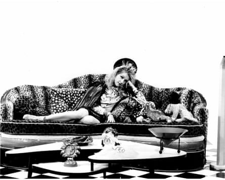 Black and white photo of woman on couch