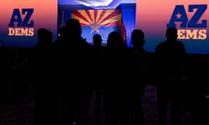 Attendees wait for election results during the Democratic Party’s Election Night watch party at Hilton Phoenix Resort