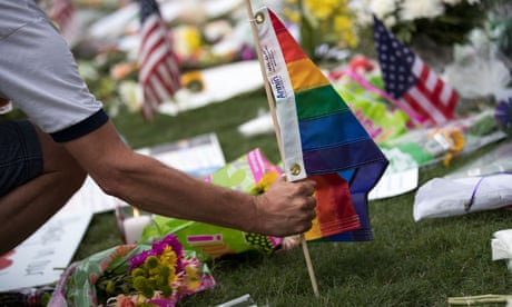 A Pride flag is planted at a makeshift memorial for victims of the Pulse shooting in Orlando, Florida, in June 2016.