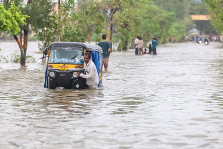 An autorickshaw in flood waters
