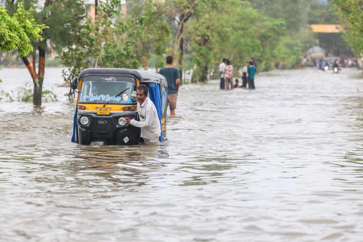 An autorickshaw in flood waters