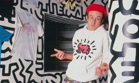 Keith Haring poses at the opening of Pop Shop.