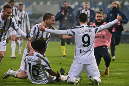 Juventus celebrate after their second goal in added time.