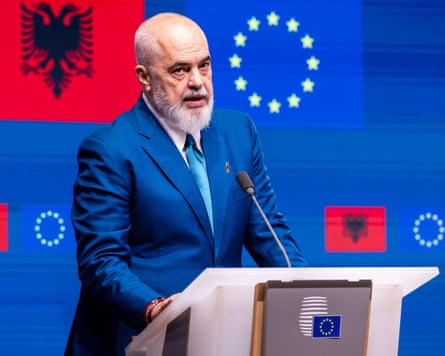 Albania’s prime minister, Edi Rama, at a podium with an EU symbol in the background