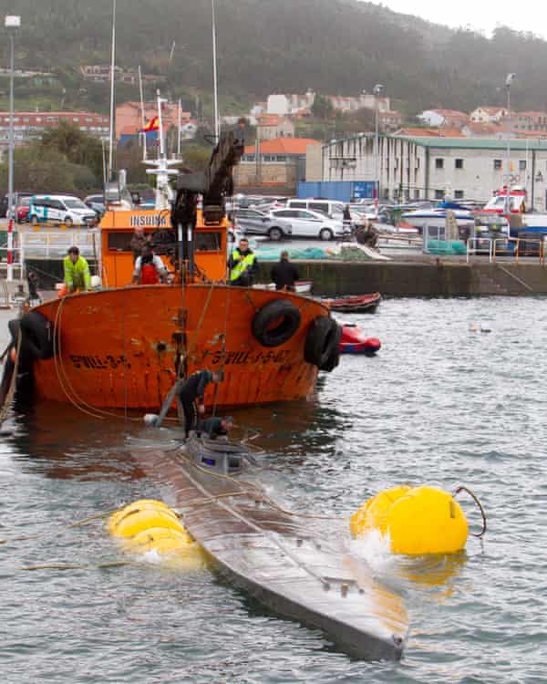 A crane ship tries to refloat the narco-submarine off Cangas de Morrazo in Galicia, Spain, in November 2019. 
