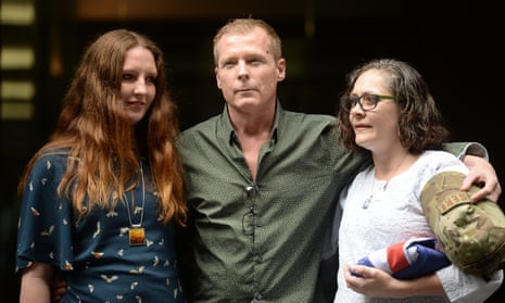 Timothy Weeks poses for a photograph with his sisters Alyssa Carter, left, and Jo Carter in Sydney