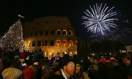 Fireworks light up the sky above the Colosseum, Rome, Italy