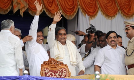 Siddaramaiah (C), the state leader of the Congress party, waves to supporters