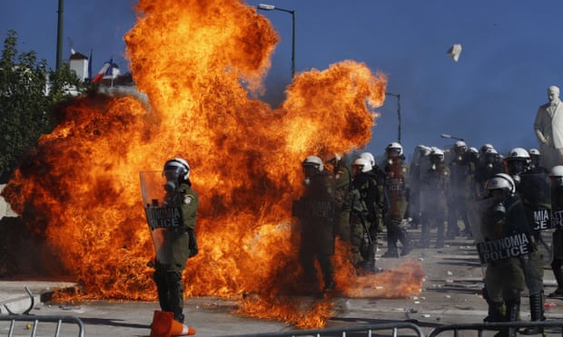 Riot police clash with demonstrators outside parliament in Athens, October 2011, as anger breaks out over new austerity measures