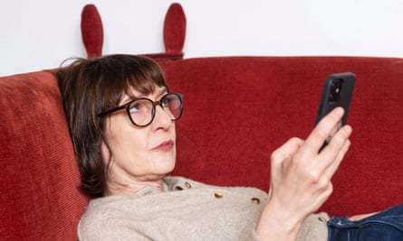 Zoe Williams reclining on a sofa