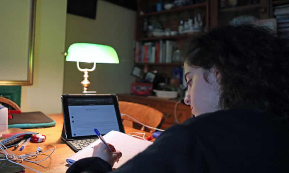 A student working remotely from home in London