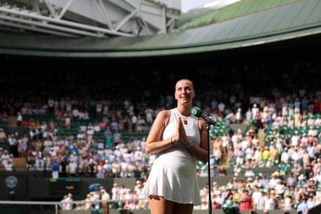 Petra Kvitova of Czechia speaks into a microphone with tears in her eyes durng an interview ahead of her retirement, following her defeat against Emma Navarro of US during the Ladies' Singles first round match on day two of The Championships Wimbledon 2025