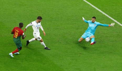 Portugal’s Diogo Costa makes a save from Uruguay’s Rodrigo Bentancur.