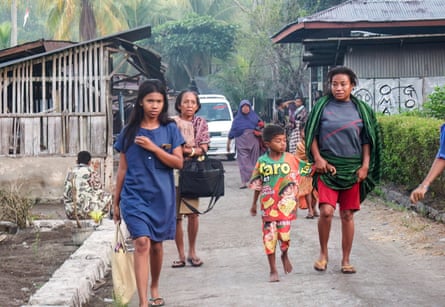 People flee their homes to seek safety following a earthquake in Talibura Village, Sikka, East Nusa Tenggara on 15 August, 2026.