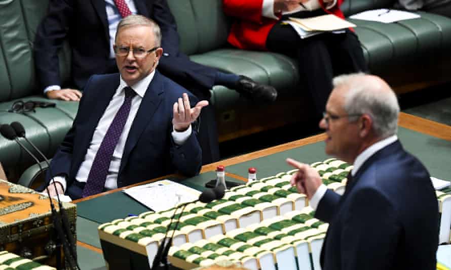 Anthony Albanese (left) listens to prime minister Scott Morrison during question time.
