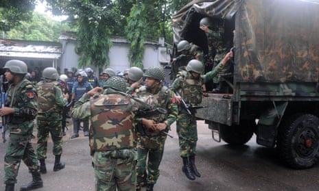 Army soldiers on a road near the Holey Artisan restaurant after Islamic militants attacked the cafe in Dhaka, Bangladesh.