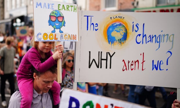A girl taking part in a climate crisis protest.