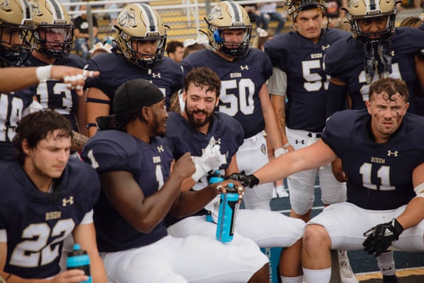 Rodney Burford Jr and Stefan Anderson talking to each other as Jacob Hartman tries to catch the latter’s attention to look at Coach Healey.