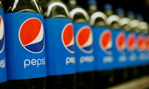 Row of Pepsi bottles on shelf