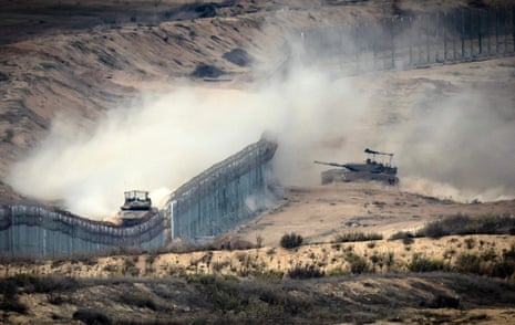 Israeli armoured vehicles near the border fence that separates Gaza and Israel.