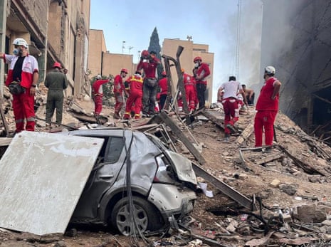 Rescue teams searching for survivors trapped beneath the rubble after an Israeli airstrike hit a damaged apartment building in northern Tehran, Iran, on 23 March 2026.