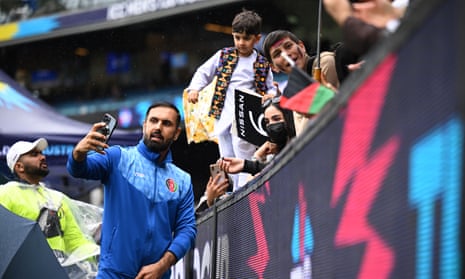 Mohammad Nabi of Afghanistan takes photos with fans at Melbourne Cricket Ground