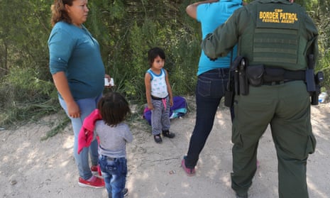 U.S. Border Patrol agents take Central American asylum seekers into custody on June 12, 2018 near McAllen, Texas. 