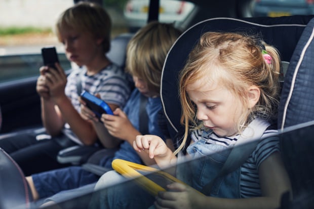 Beware of car sickness with too much screen time for children.