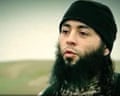 A young, dark-haired man with a long beard