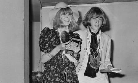 Brian Jones and Anita Pallenberg arriving at an airport