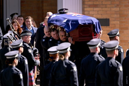The coffin of Sen Const Vadim de Waart-Hottart is carried from from the Victoria police academy chapel following his funeral service in Melbourne on 5 September 2025.