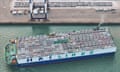 A ship loaded with cars for export leaves the port of Yantai, Shandong Province, China
