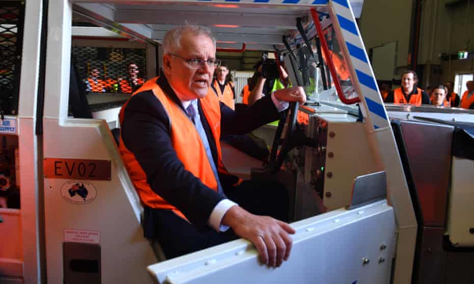 Australian prime minister Scott Morrison inside an electric vehicle at an engineering facility in the Hunter Valley