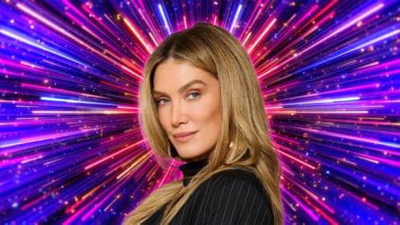 A blond woman in a pinstripe jacket