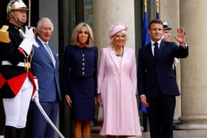 (From left) Charles, Brigitte Macron, Camilla and Emmanuel Macron, who is waving