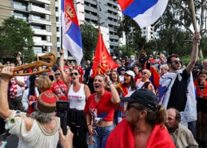 Supporters of Novak Djokovic outside the hotel in Melbourne where he is being detained.