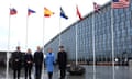 Ulf Kristersson and Crown Princess Victoria among five dignitaries in front of flags of Nato nations